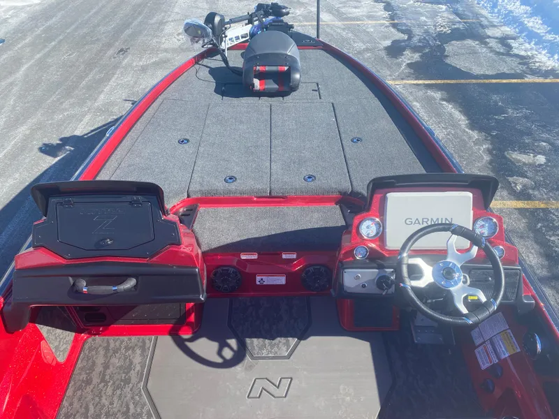 Slide: The Image of 2025 Nitro Z21 XL Pro boat interior with Garmin navigation system, red and gray design. - 6