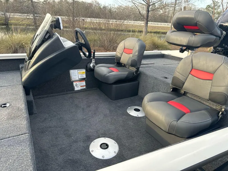 Slide: The Image of 2025 Tracker Pro Team 175 Crappie Edition boat interior with gray and red seating. - 5