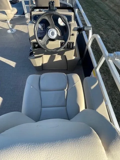 Slide: The Image of 2025 Sun Tracker Bass Buggy 16 XL Select interior with steering wheel and seating. - 3