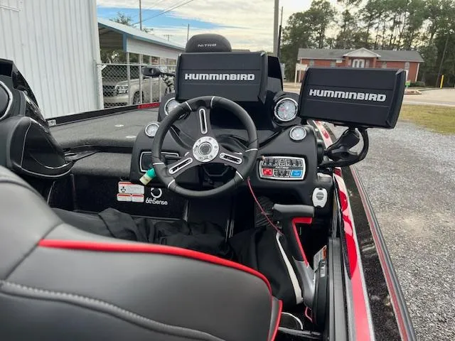 Slide: The Image of 2018 Nitro Z21 DC boat cockpit with dual Humminbird displays and steering wheel. - 6