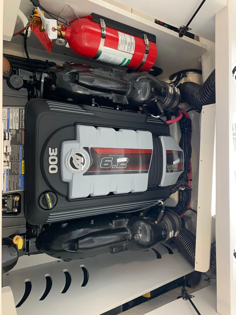 Slide: The Image of Engine compartment of 2025 Sea Ray SPX 230 with 6.2L 300 HP engine and fire extinguisher. - 11