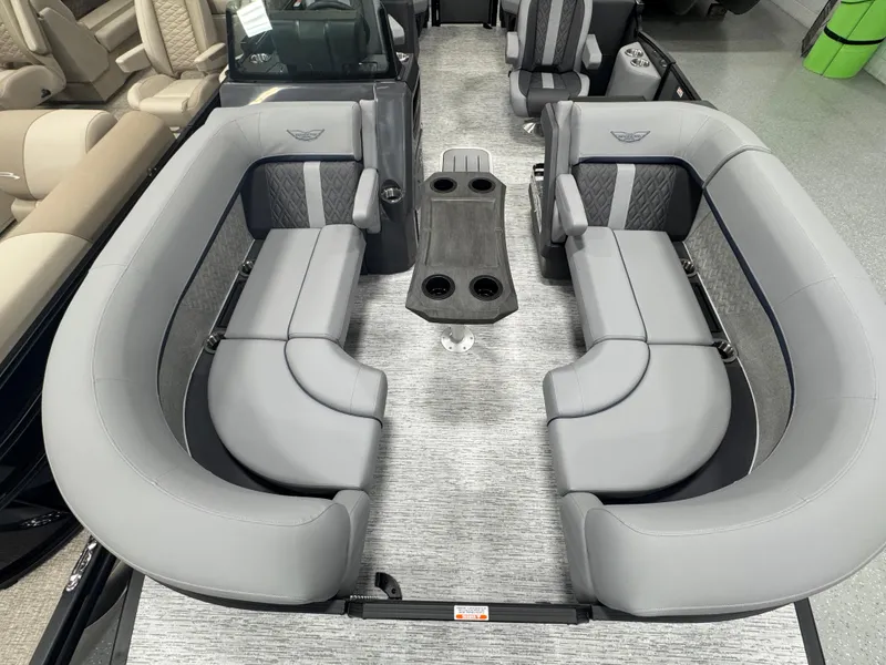 Slide: The Image of 2025 Bennington M Quad Bench 22 MFB with luxurious gray seating and central table. - 10