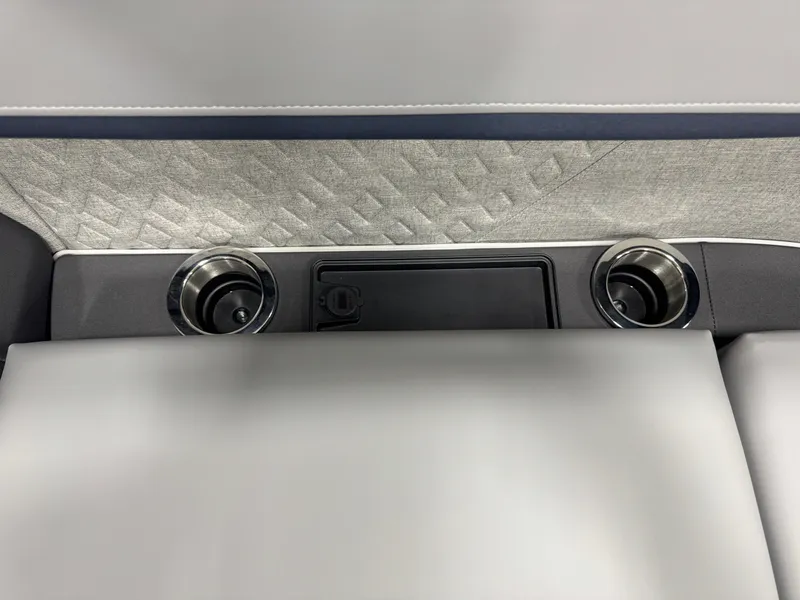 Slide: The Image of 2025 Bennington M Quad Bench 22 MFB interior with cup holders and textured upholstery. - 16