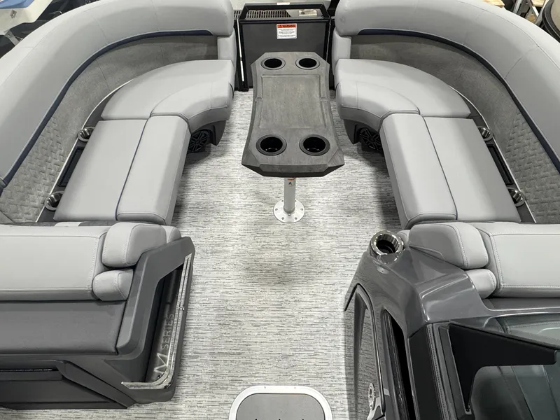 Slide: The Image of 2025 Bennington M Quad Bench 22 MFB interior with gray seating and central table. - 5