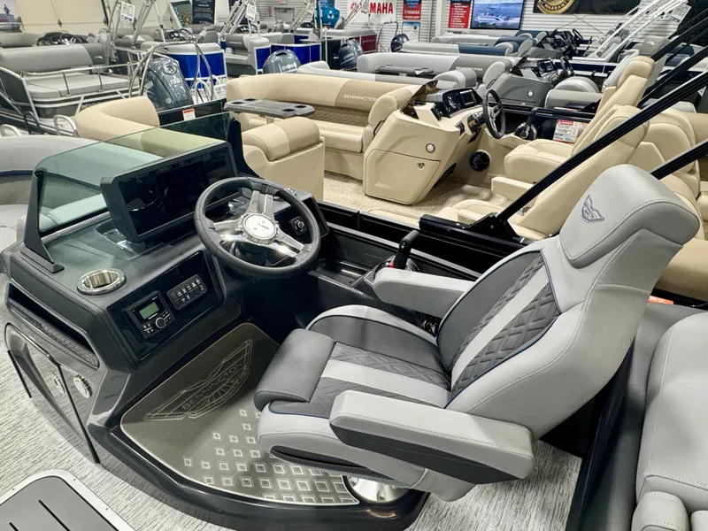 Slide: The Image of 2025 Bennington M Quad Bench 22 MFB boat interior with modern helm and seating. - 6