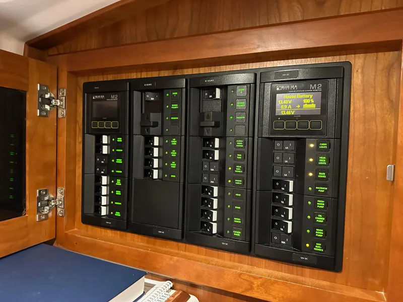 Slide: The Image of Electrical control panel on a 2018 Back Cove 32 boat, featuring multiple switches and indicators. - 22