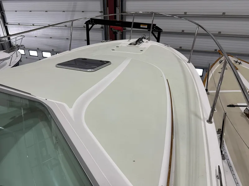 Slide: The Image of 2018 Back Cove 32 boat deck with railing in a storage facility. - 24