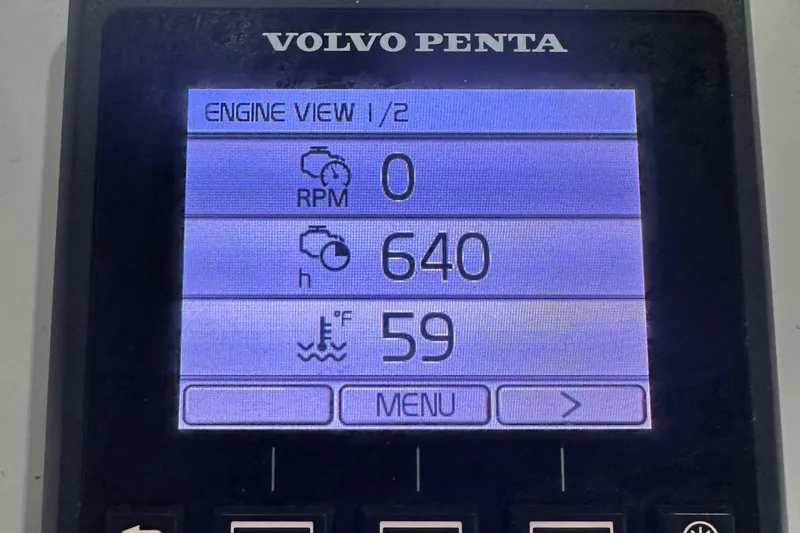 Slide: The Image of Volvo Penta engine display showing RPM, hours, and temperature for 2018 Back Cove 32. - 32
