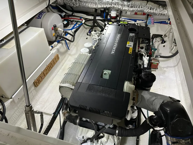 Slide: The Image of Engine room of a 2018 Back Cove 32 boat, featuring a Yanmar engine. - 33
