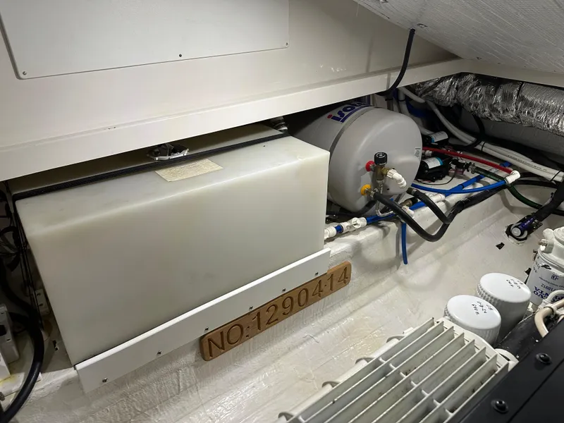 Slide: The Image of Engine room of 2018 Back Cove 32 boat, showing equipment and wiring. - 34