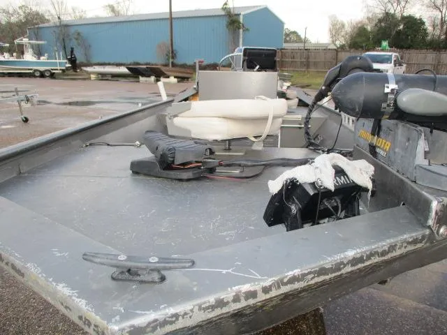 Slide: The Image of 2012 Weldcraft 1652 tunnel hull boat with equipment on deck, parked outdoors. - 4
