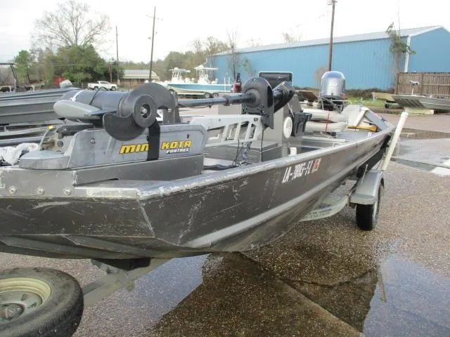 Slide: The Image of 2012 Weldcraft 1652 tunnel hull boat on trailer, equipped with Minn Kota trolling motor. - 5