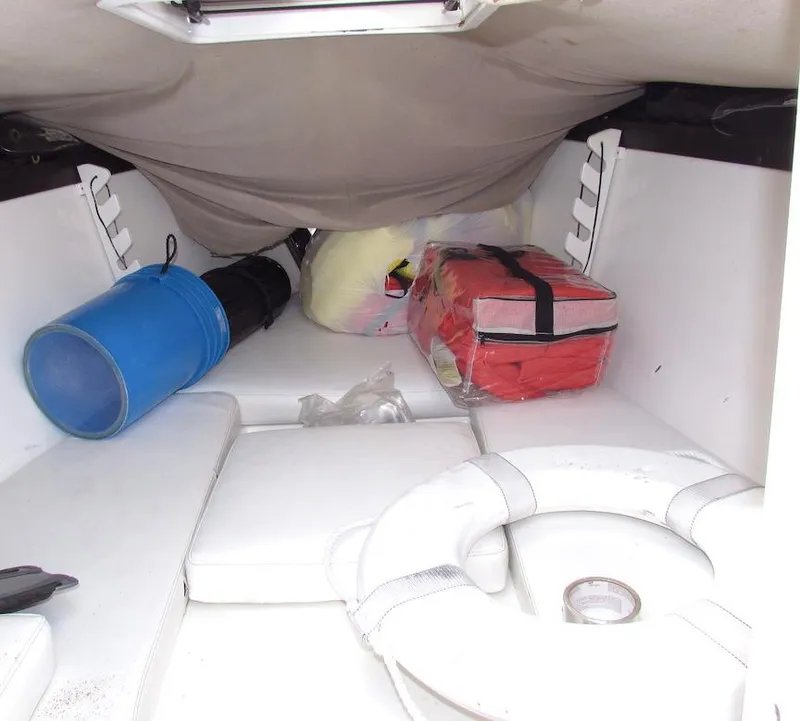 Slide: The Image of Interior of a 2005 Marlago F35 boat with life jackets and equipment. - 11