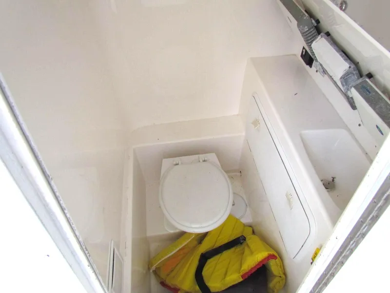 Slide: The Image of Compact bathroom in a 2005 Marlago F35 boat with life jacket. - 16