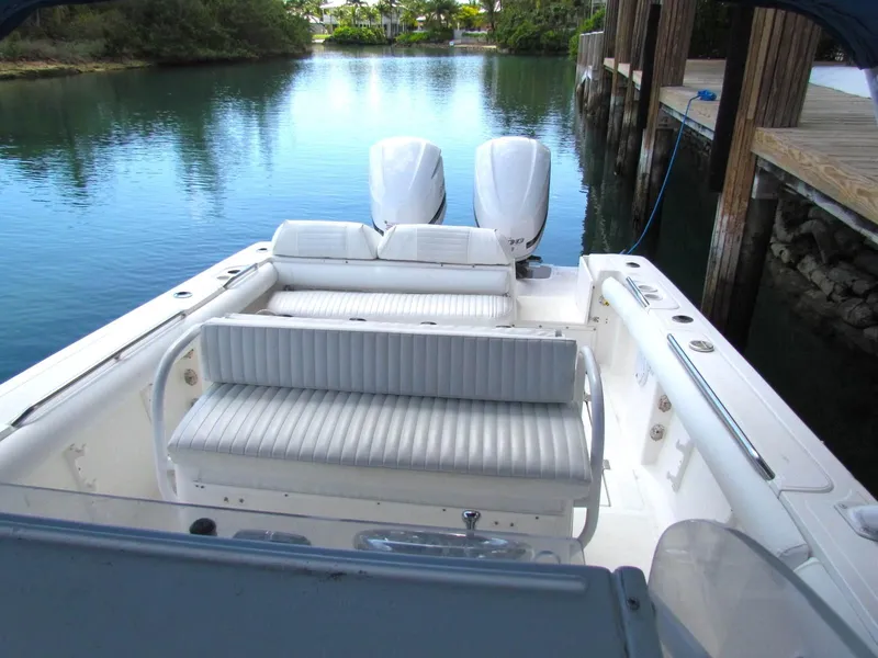 Slide: The Image of 2005 Marlago F35 boat with dual engines docked on calm water. - 4