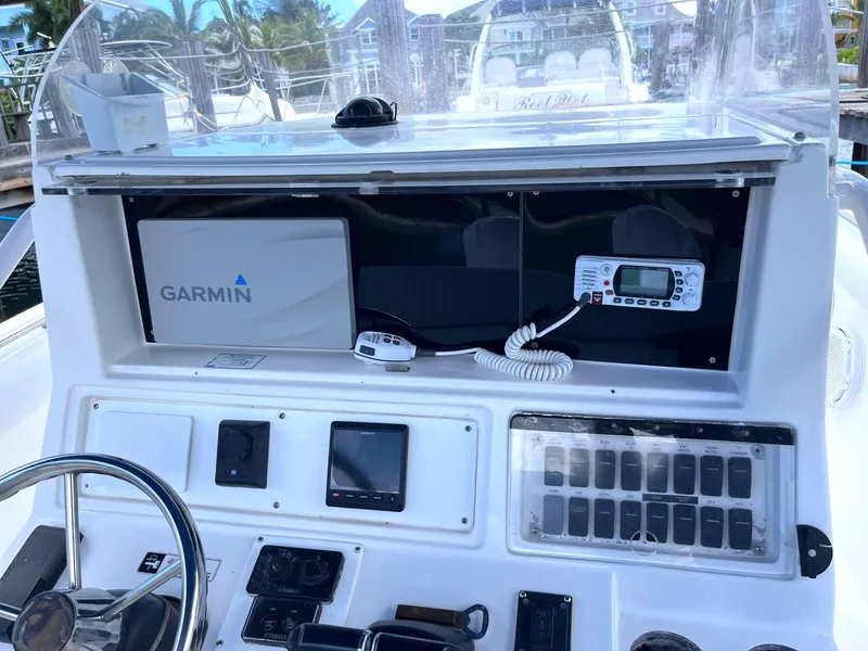 Slide: The Image of Control panel of a 2005 Marlago F35 boat with Garmin navigation system. - 5