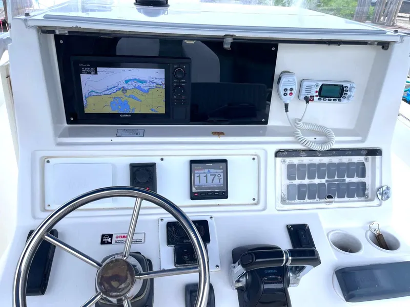 Slide: The Image of Dashboard of a 2005 Marlago F35 boat with navigation and control systems. - 7