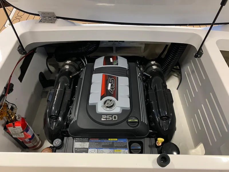 Slide: The Image of Engine compartment of 2025 Sea Ray SPX 210 boat, featuring a powerful 250 horsepower engine. - 12