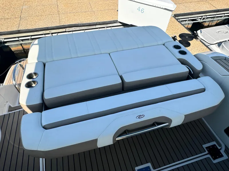 Slide: The Image of Luxurious seating on 2016 Regal 32 Express boat with cup holders and sleek design. - 12