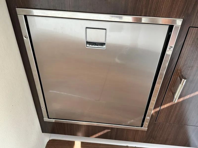 Slide: The Image of Stainless steel appliance door on 2016 Regal 32 Express yacht interior. - 24