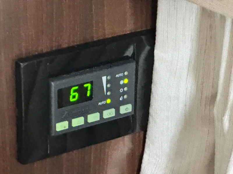 Slide: The Image of Digital thermostat set to 67 on 2016 Regal 32 Express boat. - 28