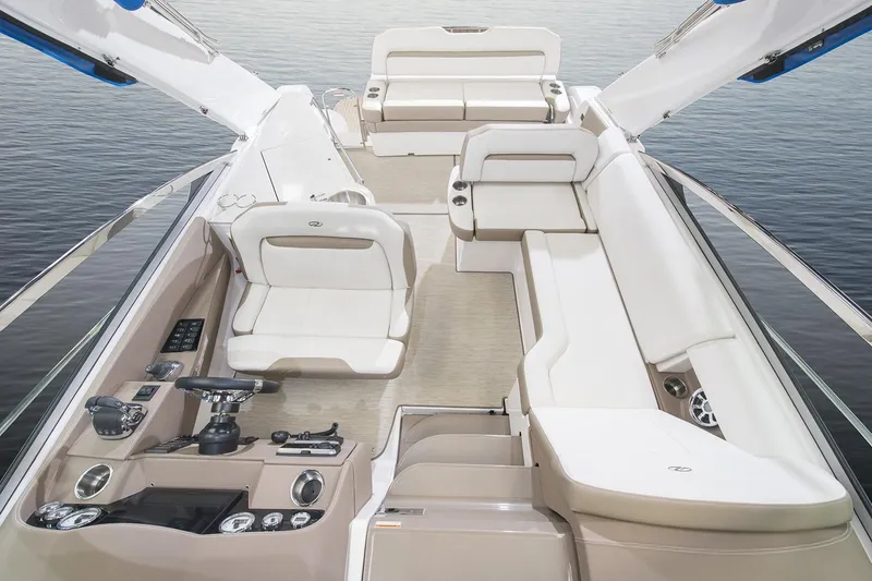 Slide: The Image of 2016 Regal 32 Express boat interior with luxurious seating and modern helm. - 34