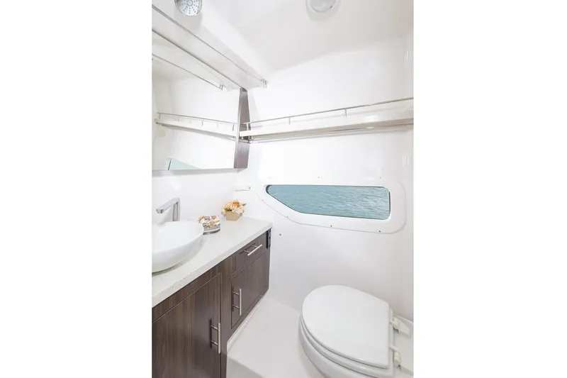 Slide: The Image of Luxurious bathroom interior of 2016 Regal 32 Express yacht with ocean view window. - 42