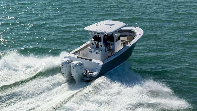 Slide: The Image of 2025 Sportsman 282 Open boat cruising on open water, showcasing twin engines. - 1