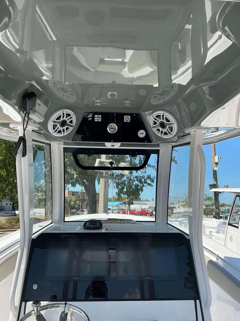 Slide: The Image of 2025 Sportsman 282 Open boat console with advanced controls and speakers. - 11