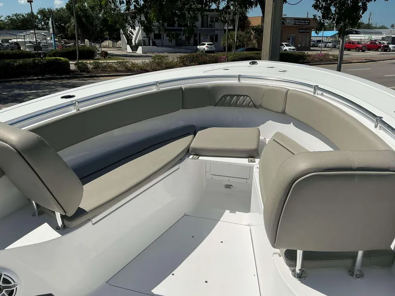 Slide: The Image of 2025 Sportsman 282 Open boat interior with cushioned seating and storage. - 12