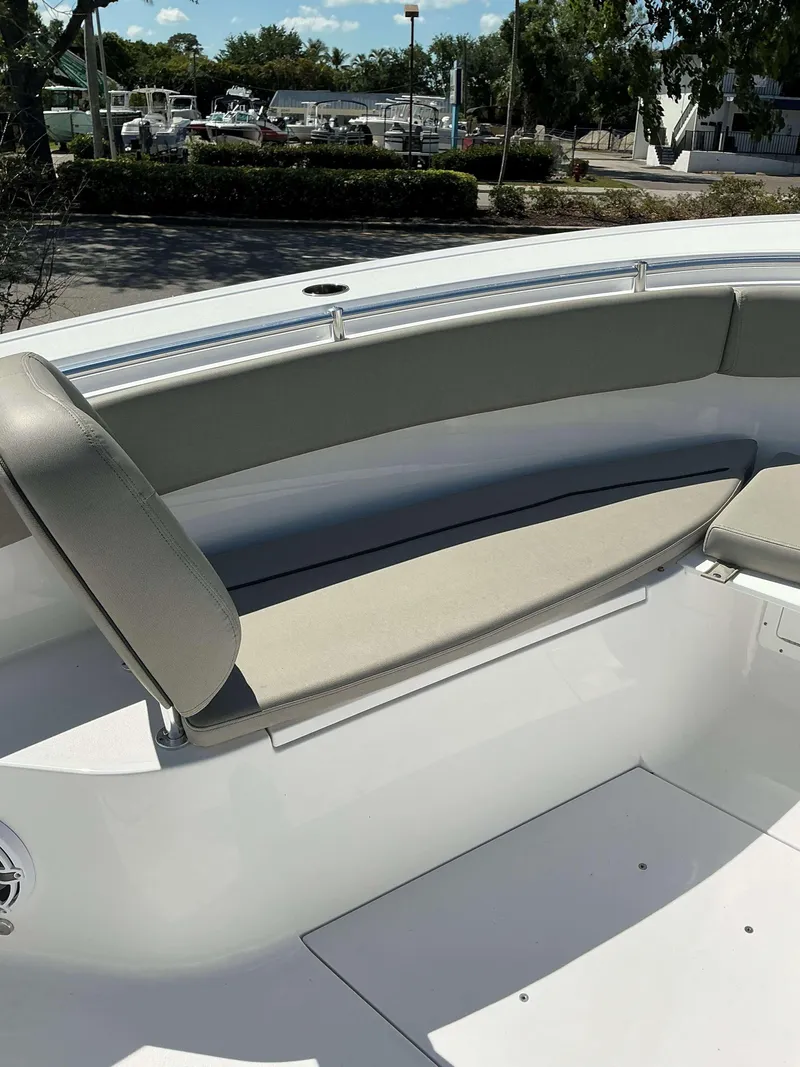 Slide: The Image of 2025 Sportsman 282 Open boat interior with cushioned seating and sleek design. - 18