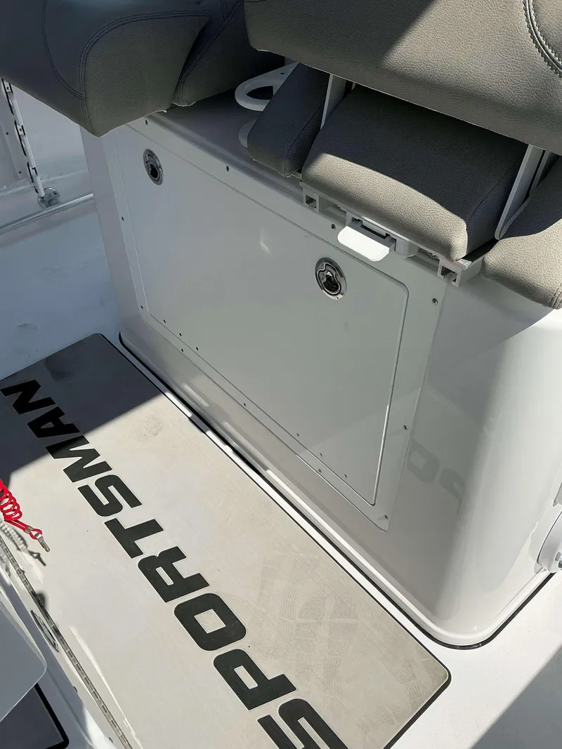 Slide: The Image of 2025 Sportsman 282 Open boat interior with seating and storage compartment. - 26