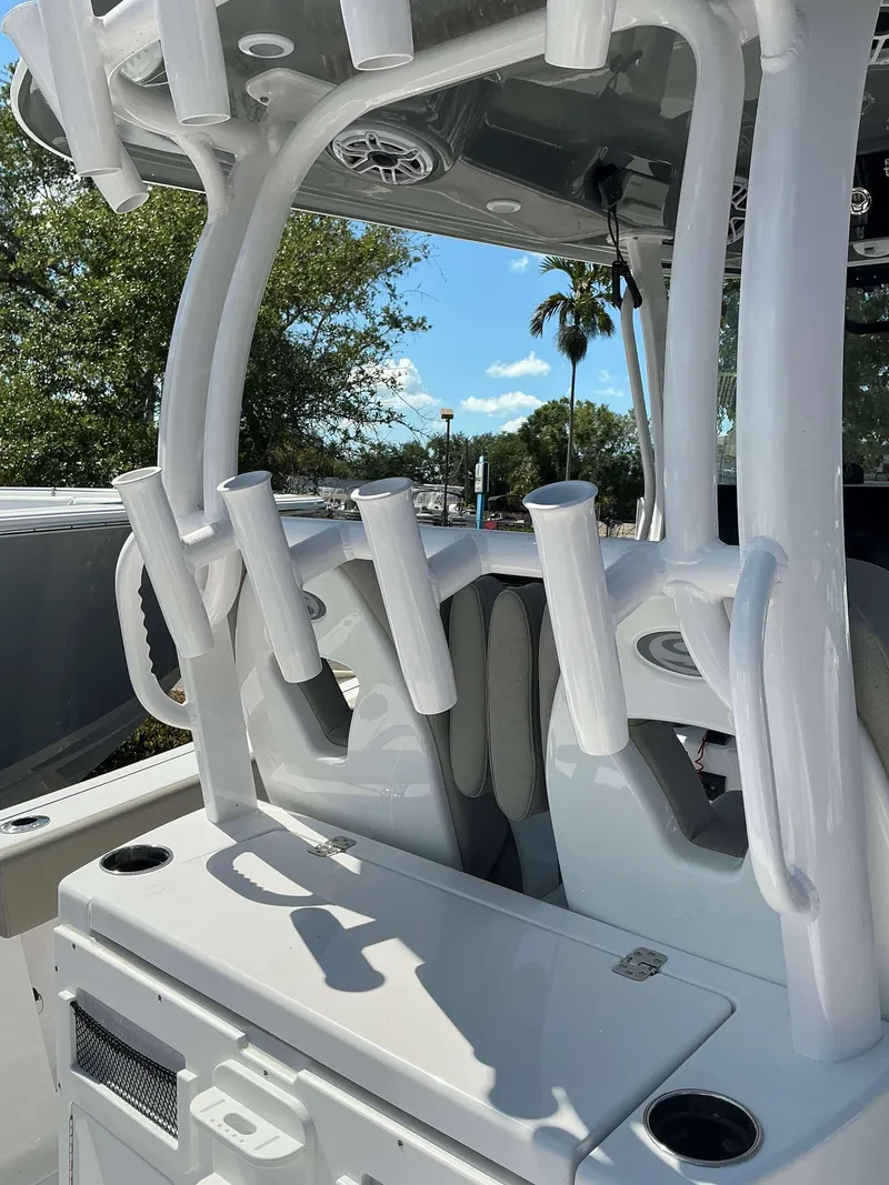 Slide: The Image of 2025 Sportsman 282 Open boat interior with rod holders and seating. - 28