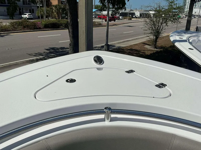 Slide: The Image of Bow of 2025 Sportsman 282 Open boat, featuring a sleek design and storage compartment. - 8