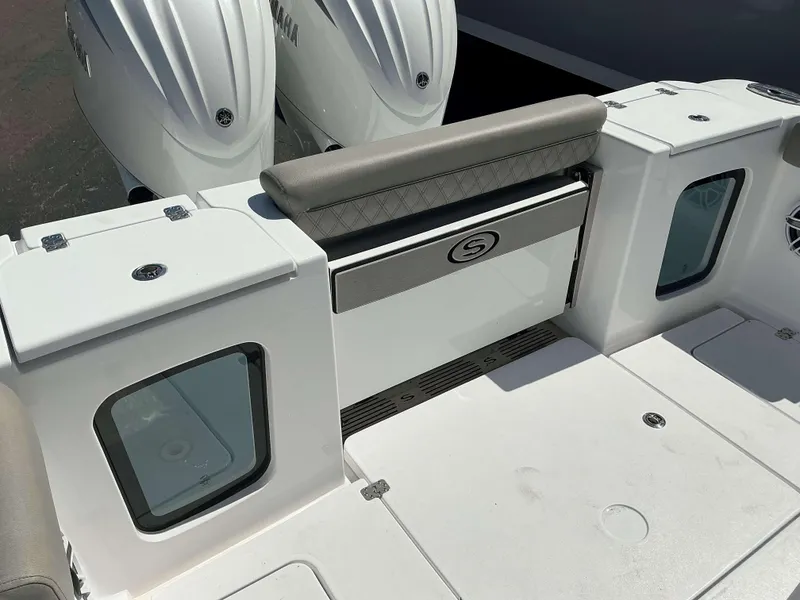 Slide: The Image of 2025 Sportsman 282 Open boat deck with Yamaha engines, featuring storage and seating. - 9