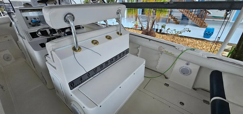 Slide: The Image of 2003 Jefferson Marlago FS35 boat interior with seating and control panel. - 14