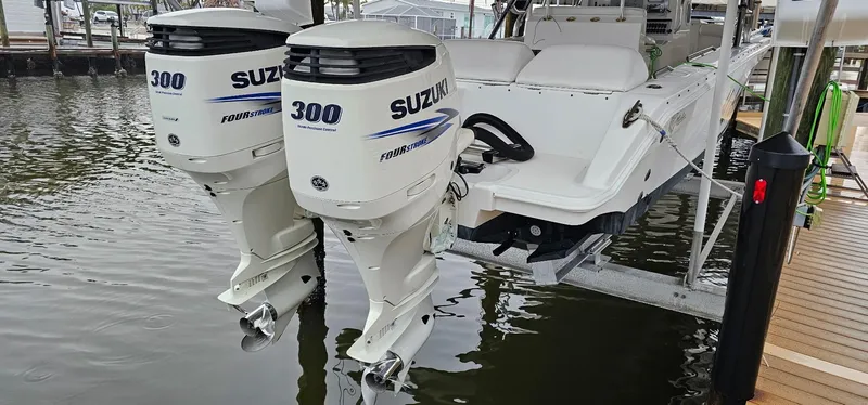 Slide: The Image of Twin Suzuki 300 outboard engines on a 2003 Jefferson Marlago FS35 boat. - 5