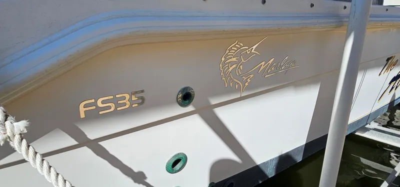 Slide: The Image of 2003 Jefferson Marlago FS35 boat with marlin logo and FS35 lettering on the side. - 6