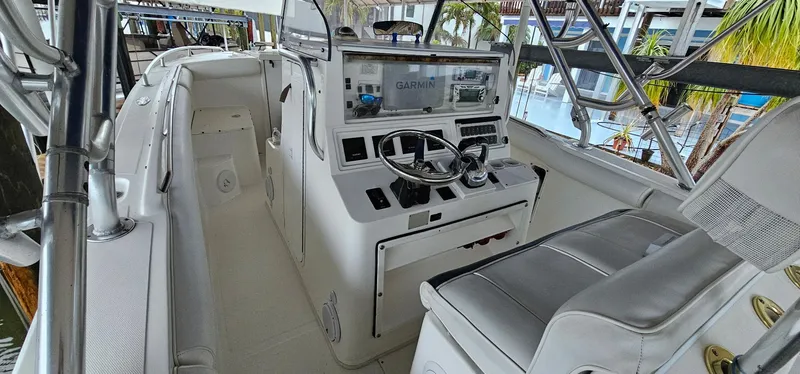 Slide: The Image of 2003 Jefferson Marlago FS35 boat cockpit with steering wheel and navigation equipment. - 7