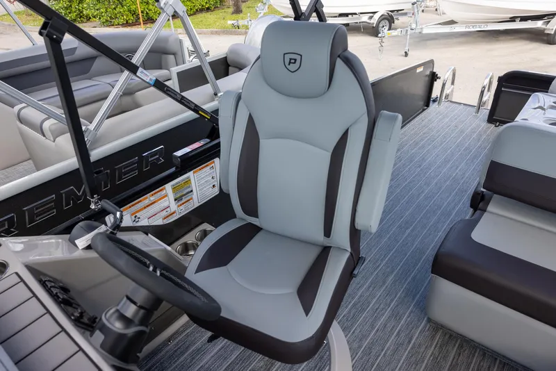 Slide: The Image of Captain's chair on 2025 Premier 230 Sunsation RS pontoon boat, featuring sleek design and comfortable seating. - 10