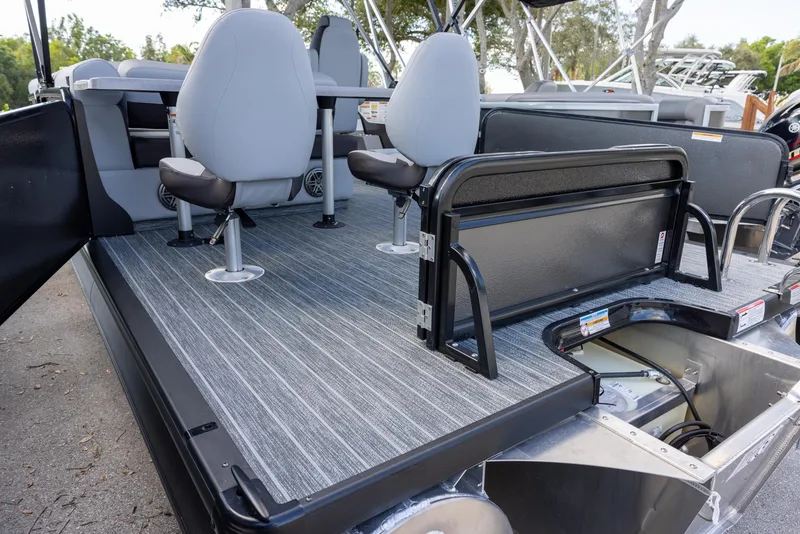 Slide: The Image of 2025 Premier 230 Sunsation RS pontoon boat interior with seating and storage compartments. - 12
