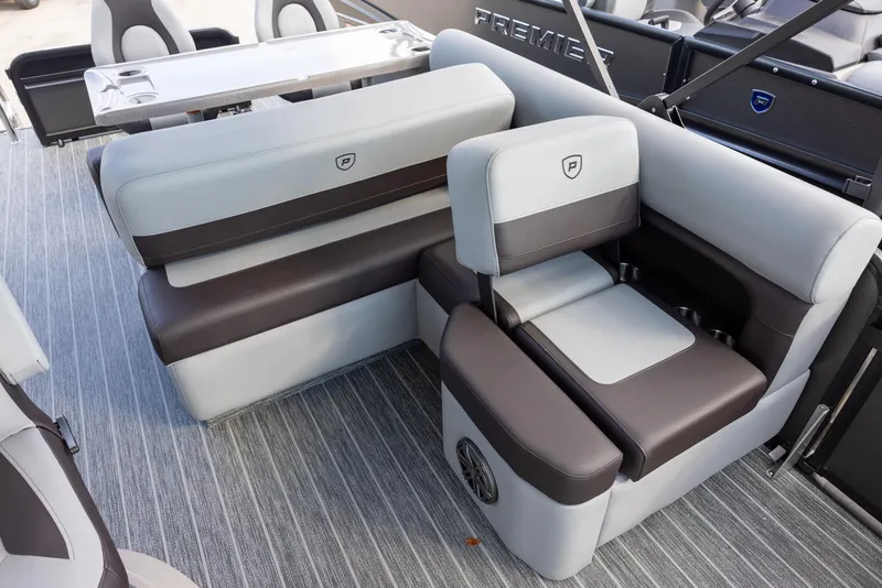 Slide: The Image of 2025 Premier 230 Sunsation RS boat interior with gray and black seating, modern design. - 6