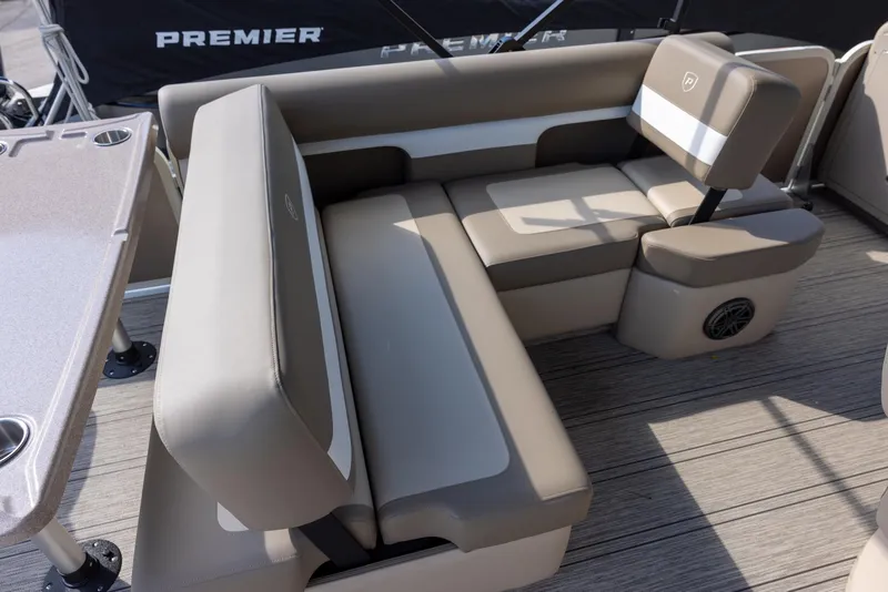 Slide: The Image of Premier 250 Sunsation RS 2025 boat interior with beige seating and table. - 16