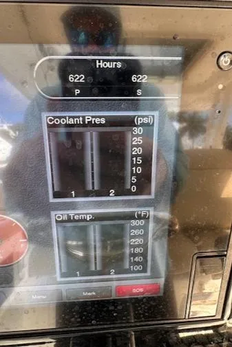 Slide: The Image of Display panel showing coolant pressure and oil temperature on a 2019 Pursuit S 328 Sport. - 16