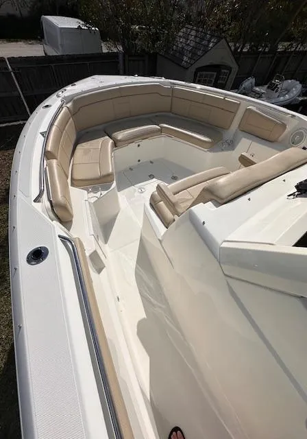 Slide: The Image of 2019 Pursuit S 328 Sport boat with beige seating and spacious deck. - 4