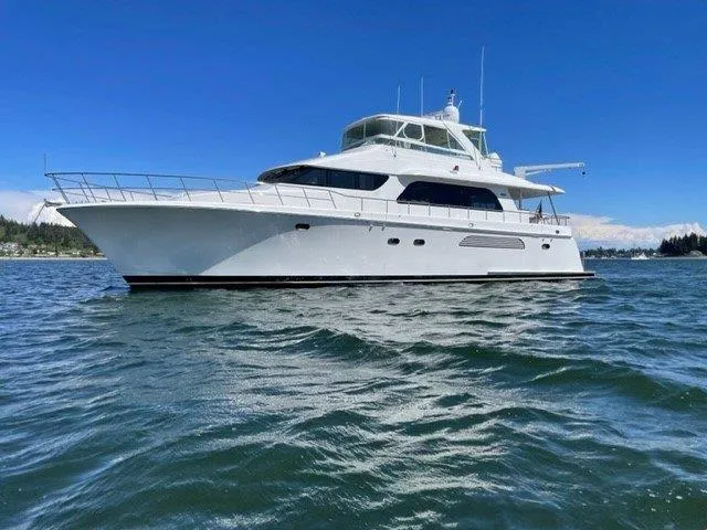 The Image of 2006 Cheoy Lee Motor Yacht on open water under clear blue sky. - 0