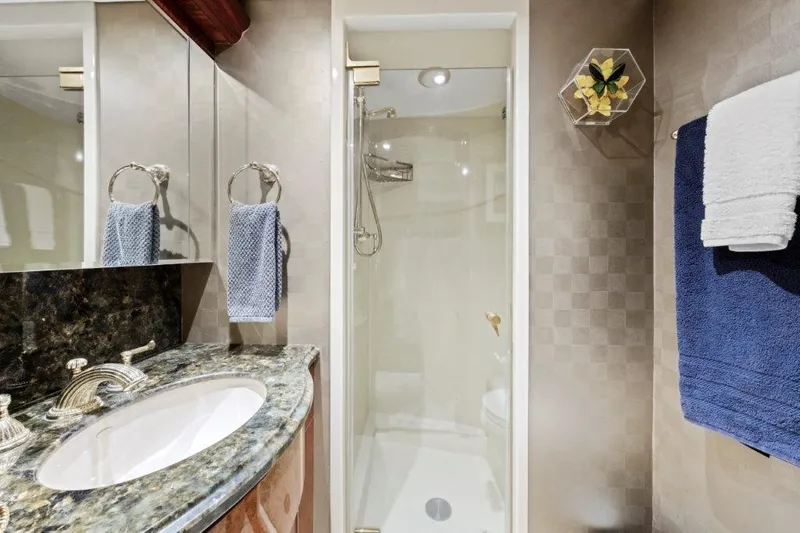 Slide: The Image of Luxurious bathroom in 2006 Cheoy Lee Motor Yacht with elegant fixtures and modern design. - 11