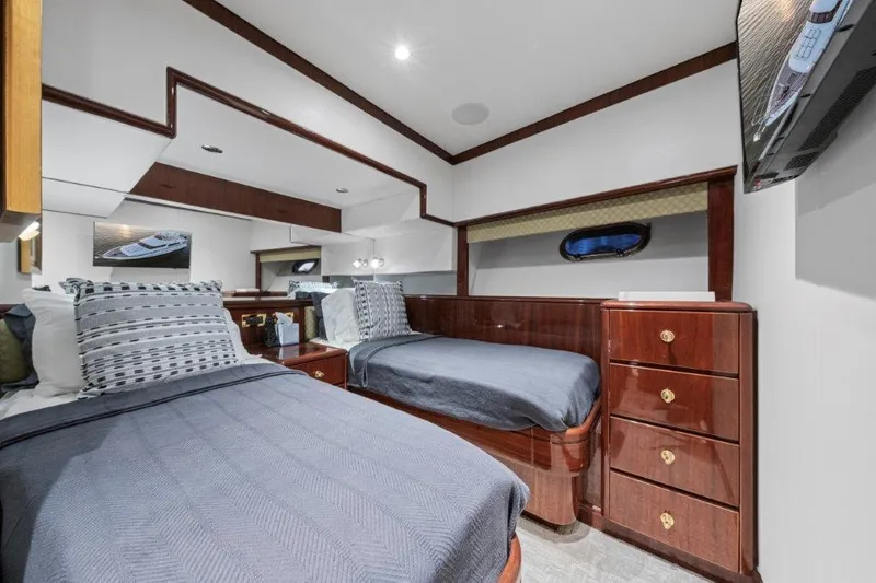 Slide: The Image of Luxurious 2006 Cheoy Lee Motor Yacht cabin with twin beds and elegant wood finishes. - 13
