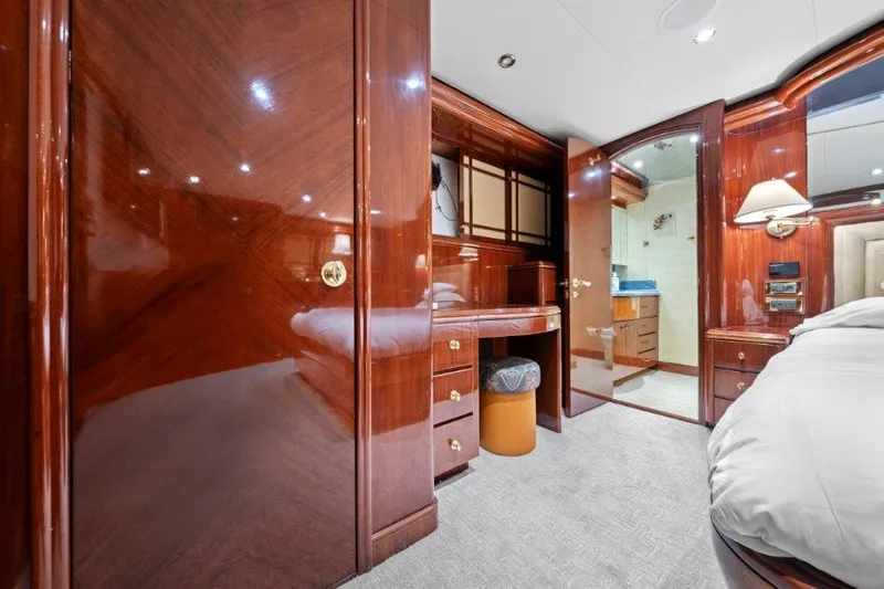 Slide: The Image of Luxurious 2006 Cheoy Lee Motor Yacht interior with polished wood and elegant furnishings. - 15