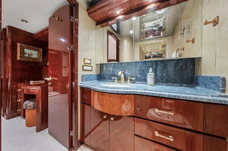 Slide: The Image of Luxurious bathroom in 2006 Cheoy Lee Motor Yacht with elegant wood cabinetry and marble countertop. - 16